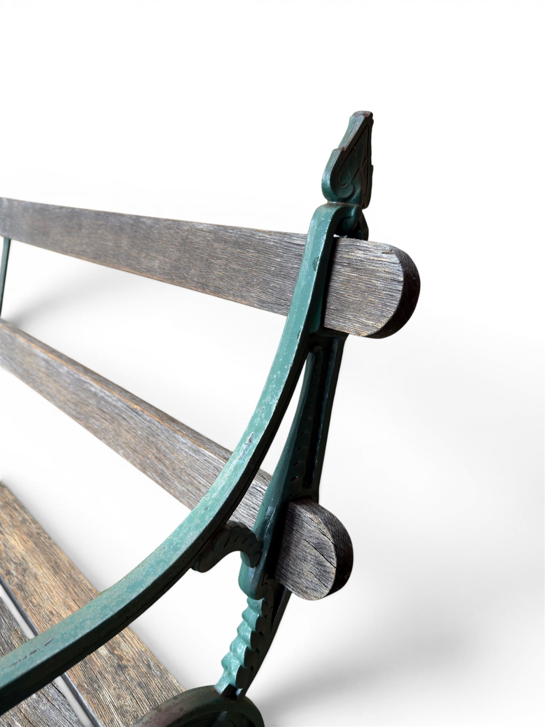 Coalbrookdale - Lily Pad design cast iron an wood slatted garden bench, late 19th century Aesthetic Movement, no. 217569, painted in green with iron centre support and seat stretcher, hardwood slatted