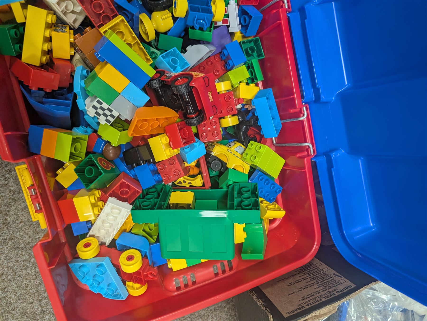 Box of loose Lego Duplo bricks, vehicles and figures