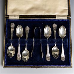 Set of six 1920s silver teaspoons and pair of sugar tongs, each decorated in relief with the Durham Cathedral sanctuary knocker and with rattail bowls, hallmarked Cooper Brothers & Sons Ltd, Sheffield 1923, contained within a fitted case