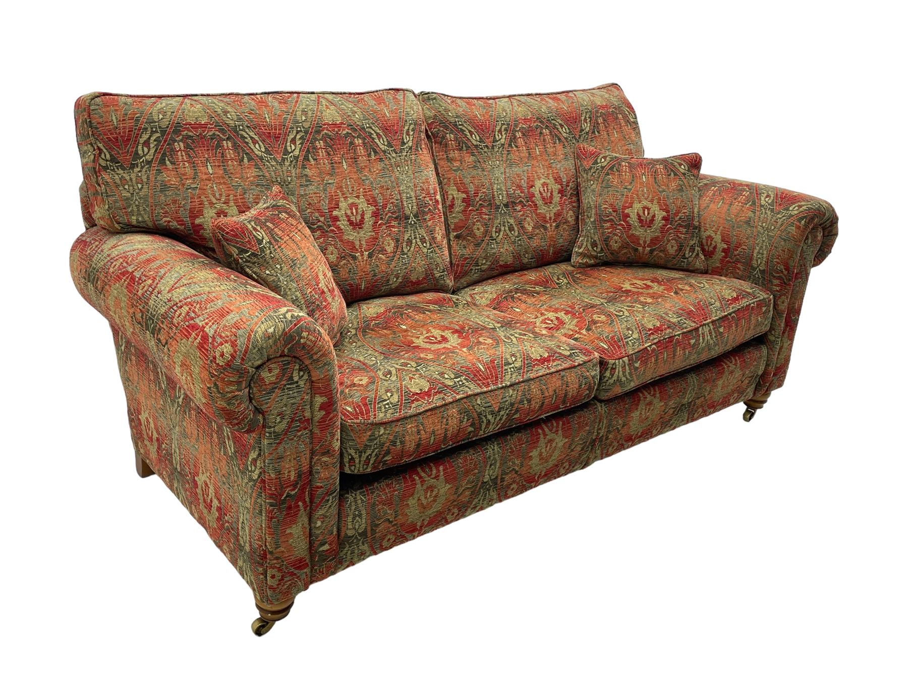 Duresta - 'Beaminster' grande two-seat sofa, traditional shape with rolled arms, upholstered in 'Althorp' russet and stone floral pattern fabric, on turned feet with brass castors
