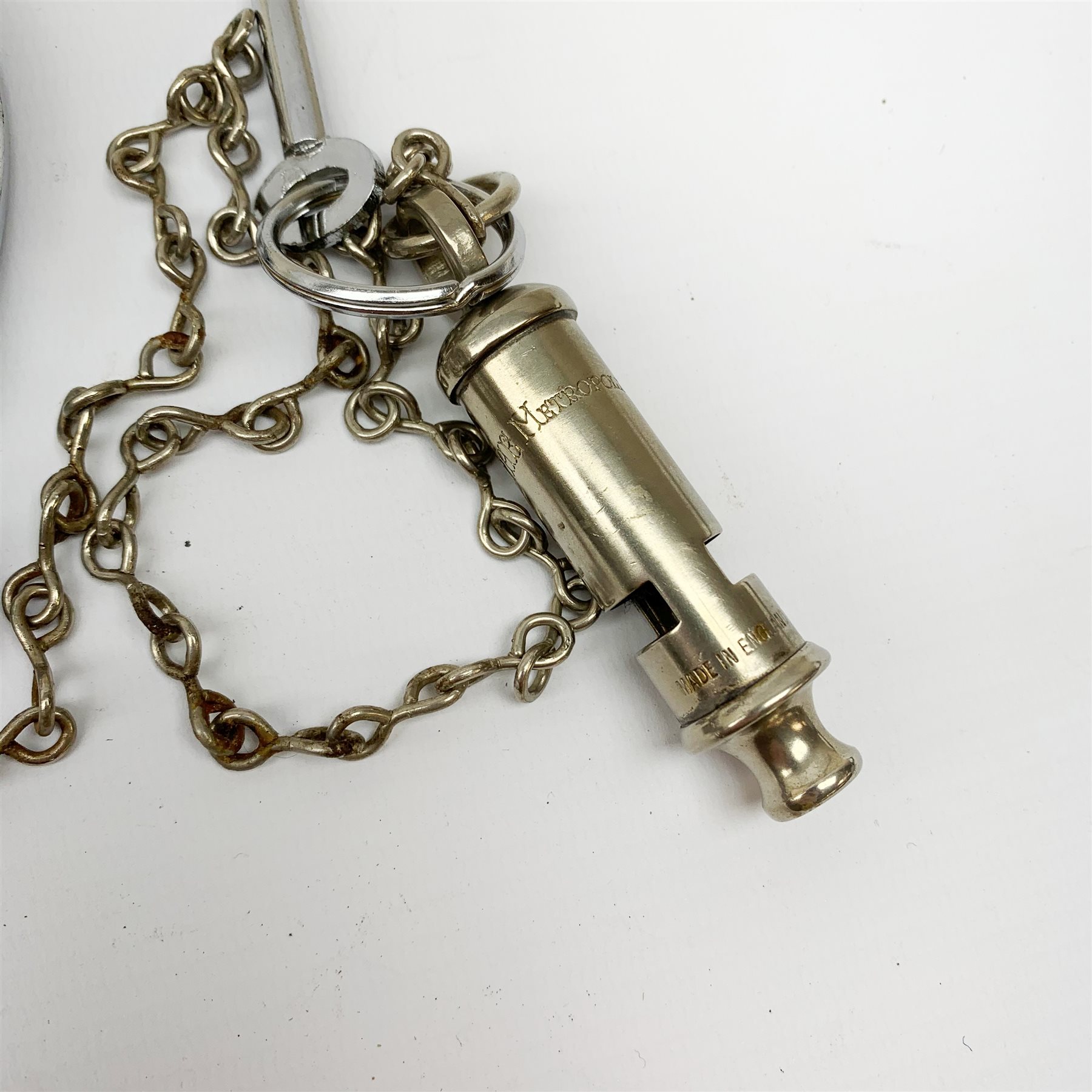 Pair of 1960's Hiatt chromium plated handcuffs with key and a 'Metropolitan' whistle