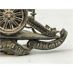 Trench Art - three WW2 brass shell case ashtrays, one mounted with Royal Artillery cap badge and button and one mounted with RA button; together with a pair of place name holders each formed from a Royal Artillery cap badge (5)