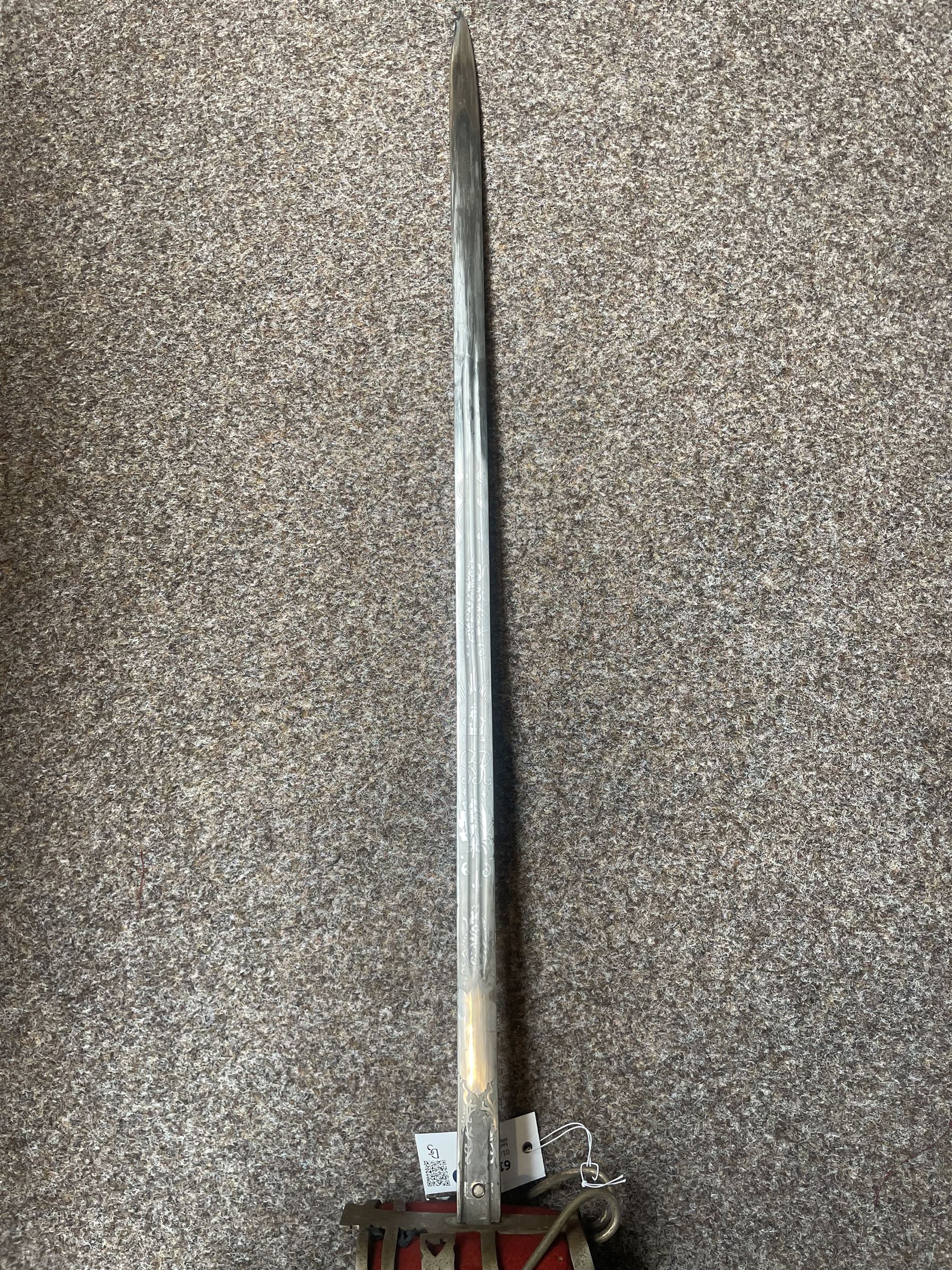 George V basket hilted broad sword with engraved blade, wire wound fish skin grip and field service scabbard, blade length 83cm