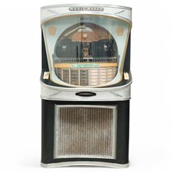 Ditchburn - 'Music Maker Panoramic 200' jukebox circa 1959, curved panoramic glazed front offering full view of the automatic selection process, accommodating 100 records (200 selections), with a stereo sound system, the aluminium trim over a woven speaker grille with an all-over ebonised and silver finish