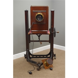  Late 19th century mahogany and brass Studio plate camera with Cooke Portrait Anastiigmat 15inch 380m Series 11 E f/45 lens No.221191 & Taylor, Taylor And Hobson Cooke 121/2 inch Portrait lens f/3.5 Series 11.A. No.97957, manual shutter release, on Century cast iron and stained wood adjustable stand, H173cm, W73cm, D80cm    
