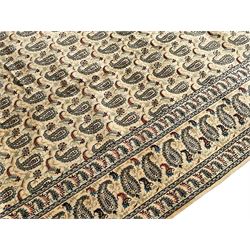 Persian ivory ground carpet, the field decorated with all-over Boteh motifs, the multi-band border with repeating Boteh patterns 
