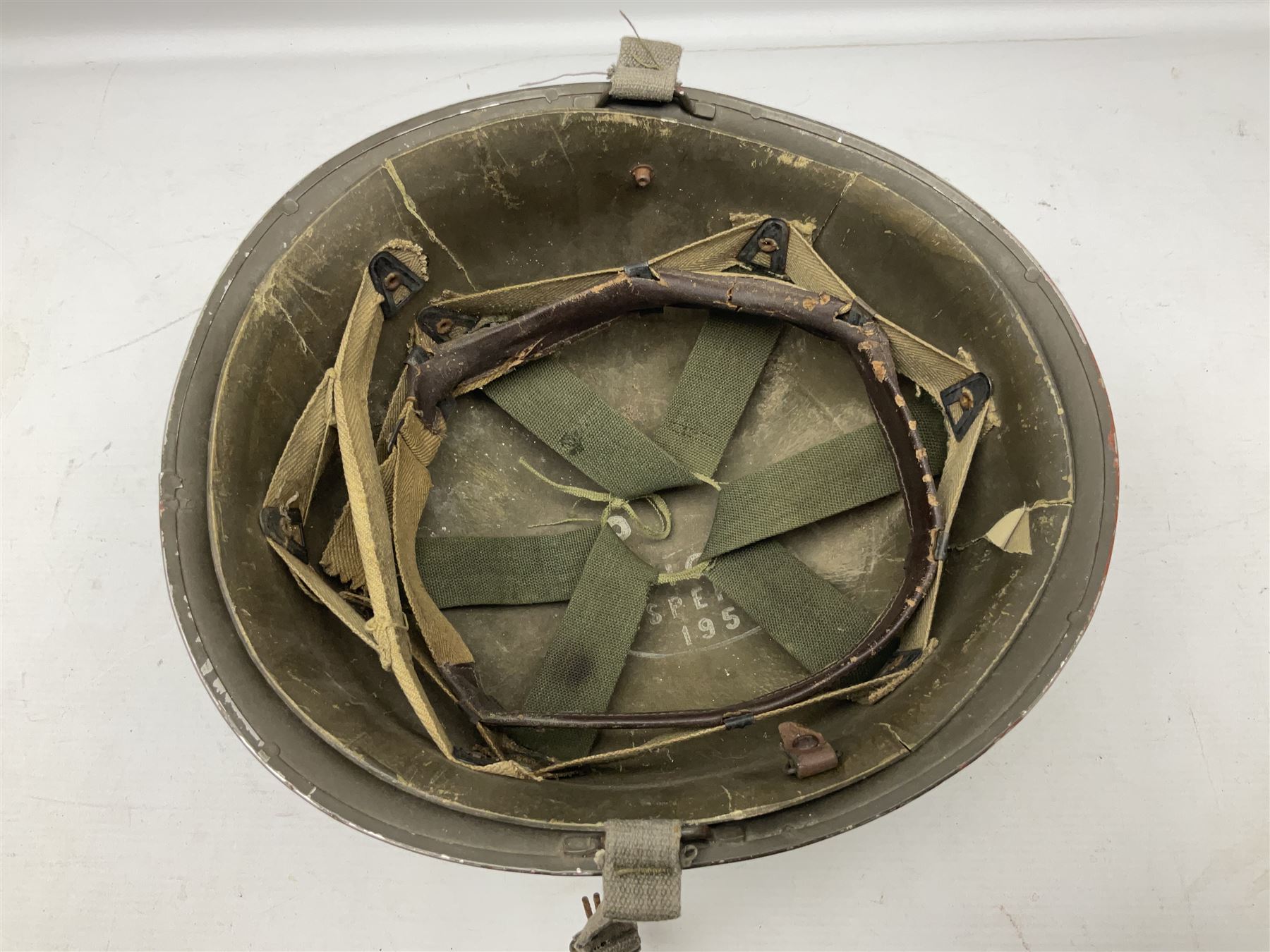 French Algerian War Red Cross steel helmet, marked 'CP ICA Esperaza 1955'; green finish with crudely painted Red Cross logo to the front