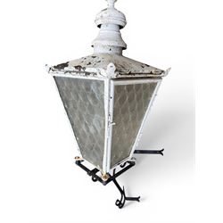 Foster & Pullen (Bradford est. 1896) - Good pair of late 19th century copper coach house or street lamps, painted in rustic white finish, with iron corner brackets, one with clear glass, the other with ring mottled glass, both converted to electricity, height with bracket 150cm