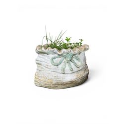 Four cast stone garden planters in the form of ribbon tied planting sacks