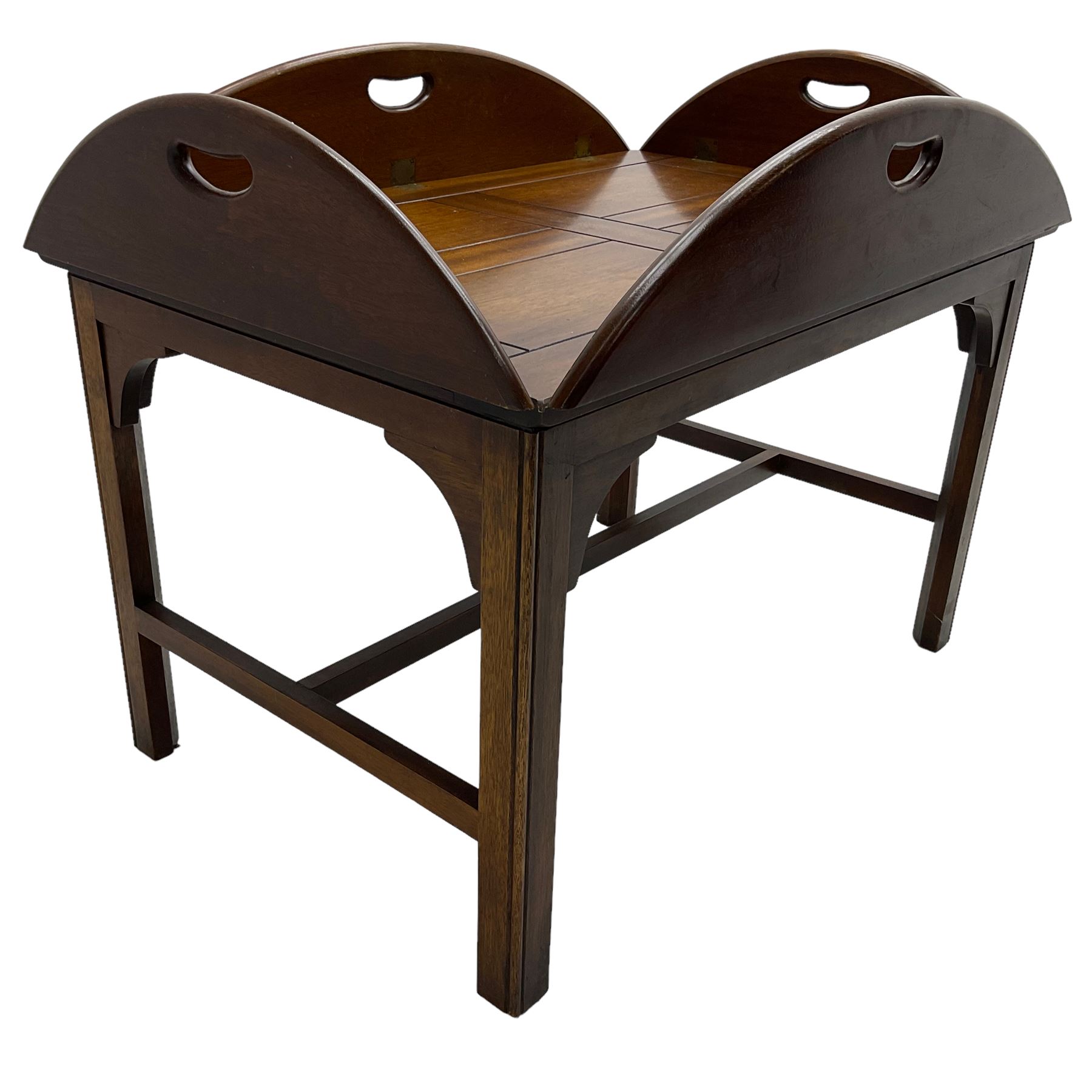 Mahogany butler's tray top coffee table, the removable tray with hinged sides and ends pierced with handles, on square moulded supports united by H stretcher 