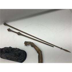 Spanish carved figure of Don Quixote, holding a book, base stamped 'Ouro, together with two spelter figures and one other