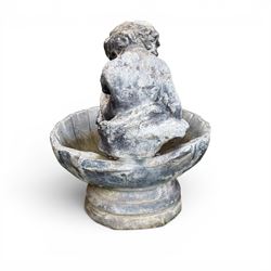 19th century lead bird bath depicting a seated cherub on a shell
