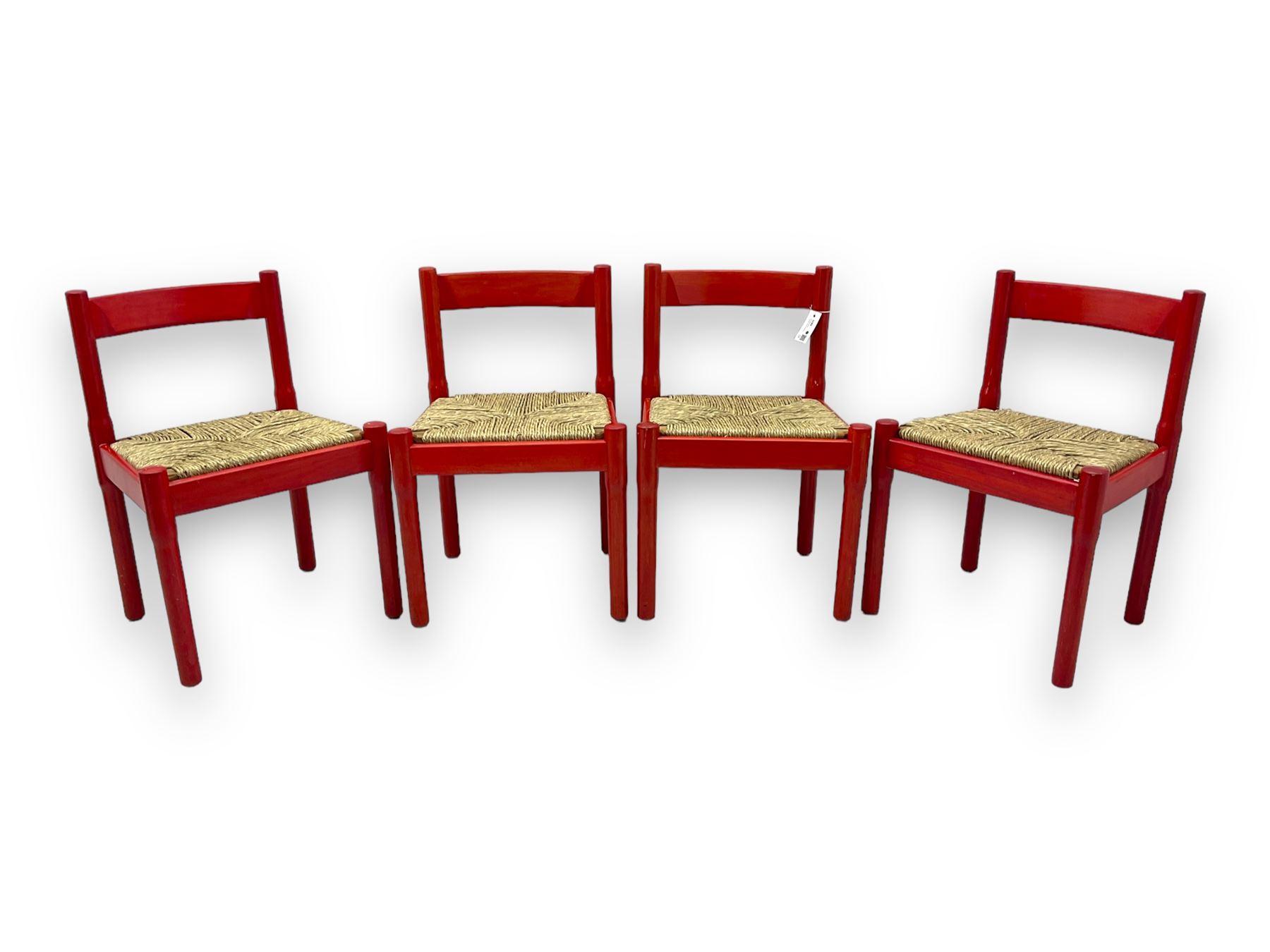 Vico Magistretti - mid-20th century circa. 1970s set of four beech framed dining chairs in red finish, with drop-in rush seats
