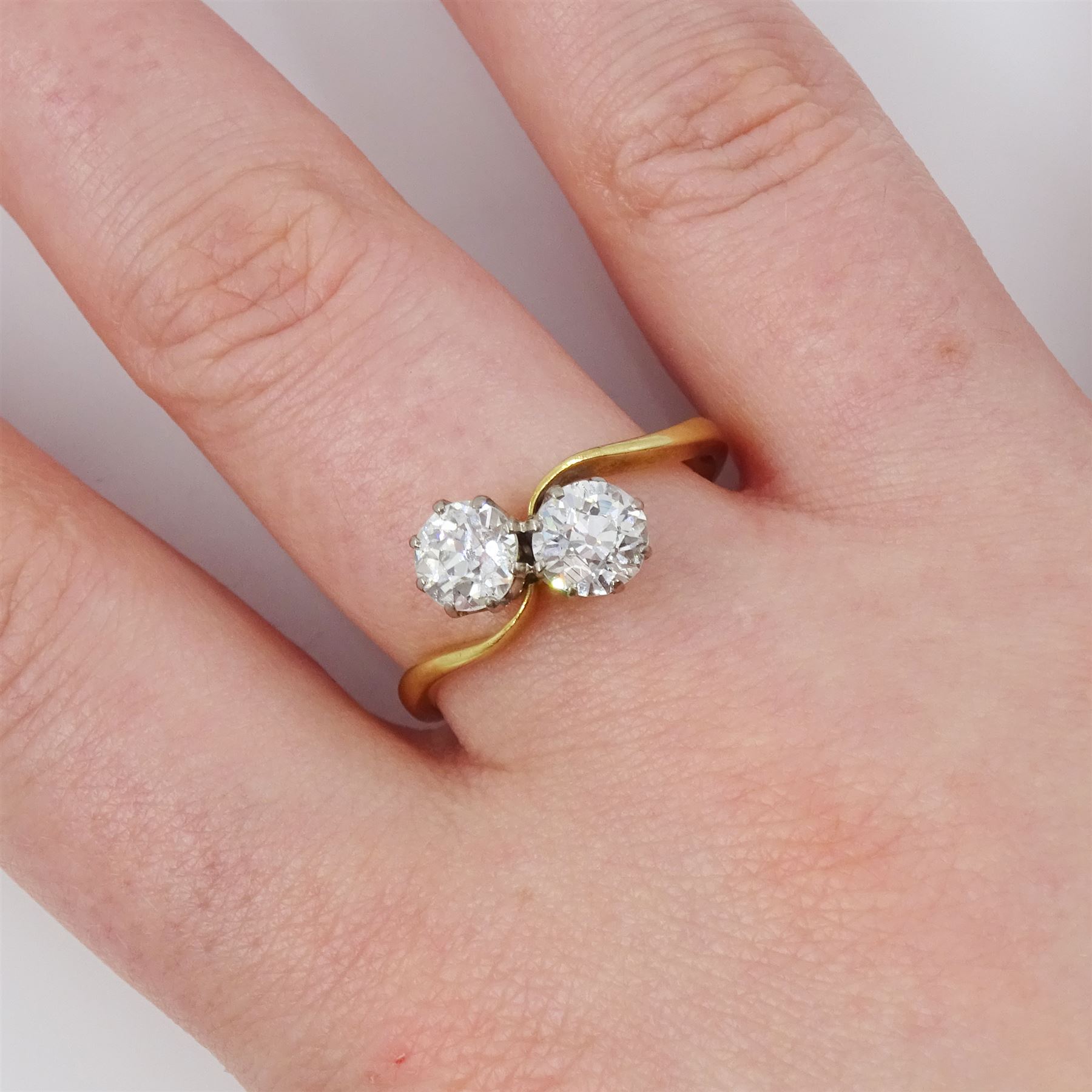 Gold diamond ring, crossover set with two old cut diamonds, stamped 18ct, total diamond weight approx 1.30 carat