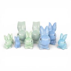 Nine Sylvac rabbits, including models 1028, 990, 1026 etc, in blue and green, largest H25cm  