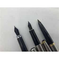 Group of Parker fountain and ballpoint pens, comprising a black Chinese style pen with engraved barrel and gold nib stamped 18K-750, gold plated example with engine turned decoration and gold nib stamped 14K, and five further to include stainless steel examples, together with two Cross USA pens and Parker pen box (9)