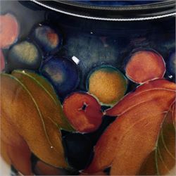 William Moorcroft vase decorated in the leaves and berries pattern, signed to base H21cm 