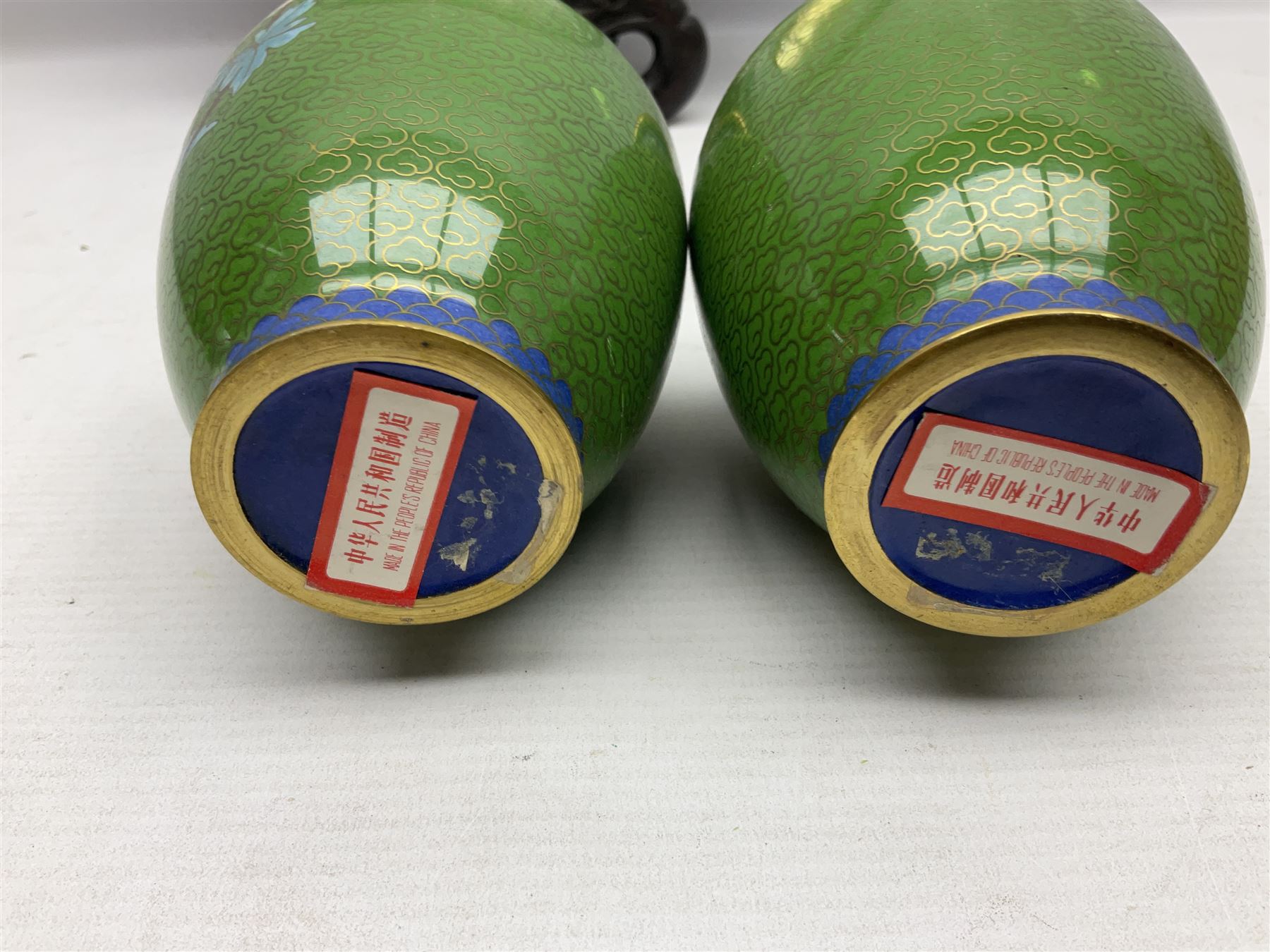 Cloisonné plate decorated with birds and flowers, together with a pair of Cloisonné vases of baluster form 