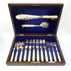 A mahogany cased Walker & Hall set of six fish knives and forks, and pair of fish servers, with engraved silver plated blades and prongs, and silver ferrules hallmarked Walker & Hall, Sheffield 1922 and 1923, the case with inset vacant brass cartouche to the hinged cover, the interior with inset Walker & Hall maker's plaque. 