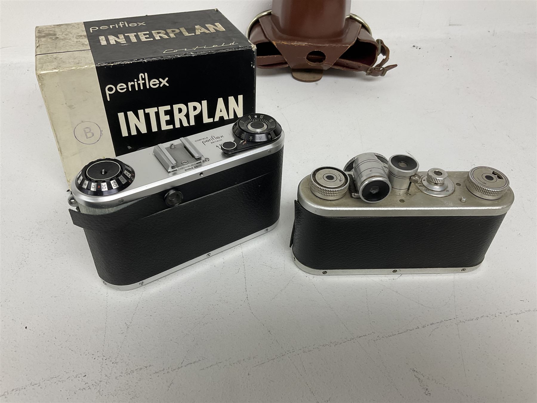 Corfield Periflex I 35mm periscope camera body,  with 'Corfield Lumar-X 1:3,5/50' lens, and Corfield Interplan-B camera body, serial no. 9111482 in original box, and with ready case