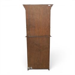 Arts & Crafts oak bureau bookcase, projecting cornice with leaded and glazed upper cabinet, the lower section with fall front section revealing a fitted interior, above shaped lower shelving 
