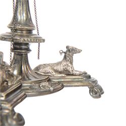 Edwardian silver plated centrepiece stand, the tripart base with applied recumbent hunting dogs interspersed with fox masks and game birds, the central knopped and tapering stem leading to a circular stand, marked 3251 beneath, H22cm  