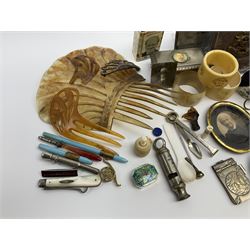 A group of assorted collectables, to include small oval purple guilloche enamel frame, WWII matchbox holder depicting Winston Churchill, Halcyon Days enamel box, Ronson table lighter, ebonised glove stretchers, ivory napkin ring, mother of pearl handled button hook, engine turned cigarette case, etc. 