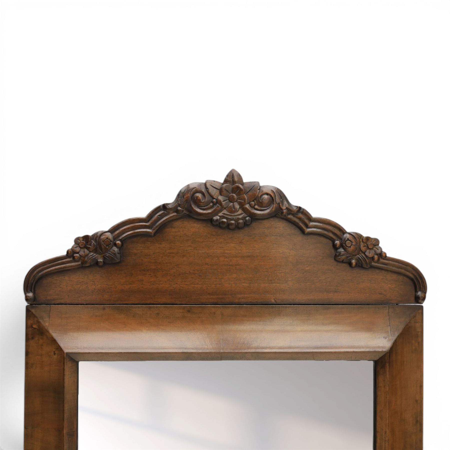 Late 19th century walnut dressing mirror, rectangular mirror plate within a moulded frame, shaped carved crest with floral and foliate detail