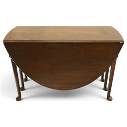 George III oak six-legged drop-leaf dining table, the oval drop-leaf top over six gate-leg supports with pad feet