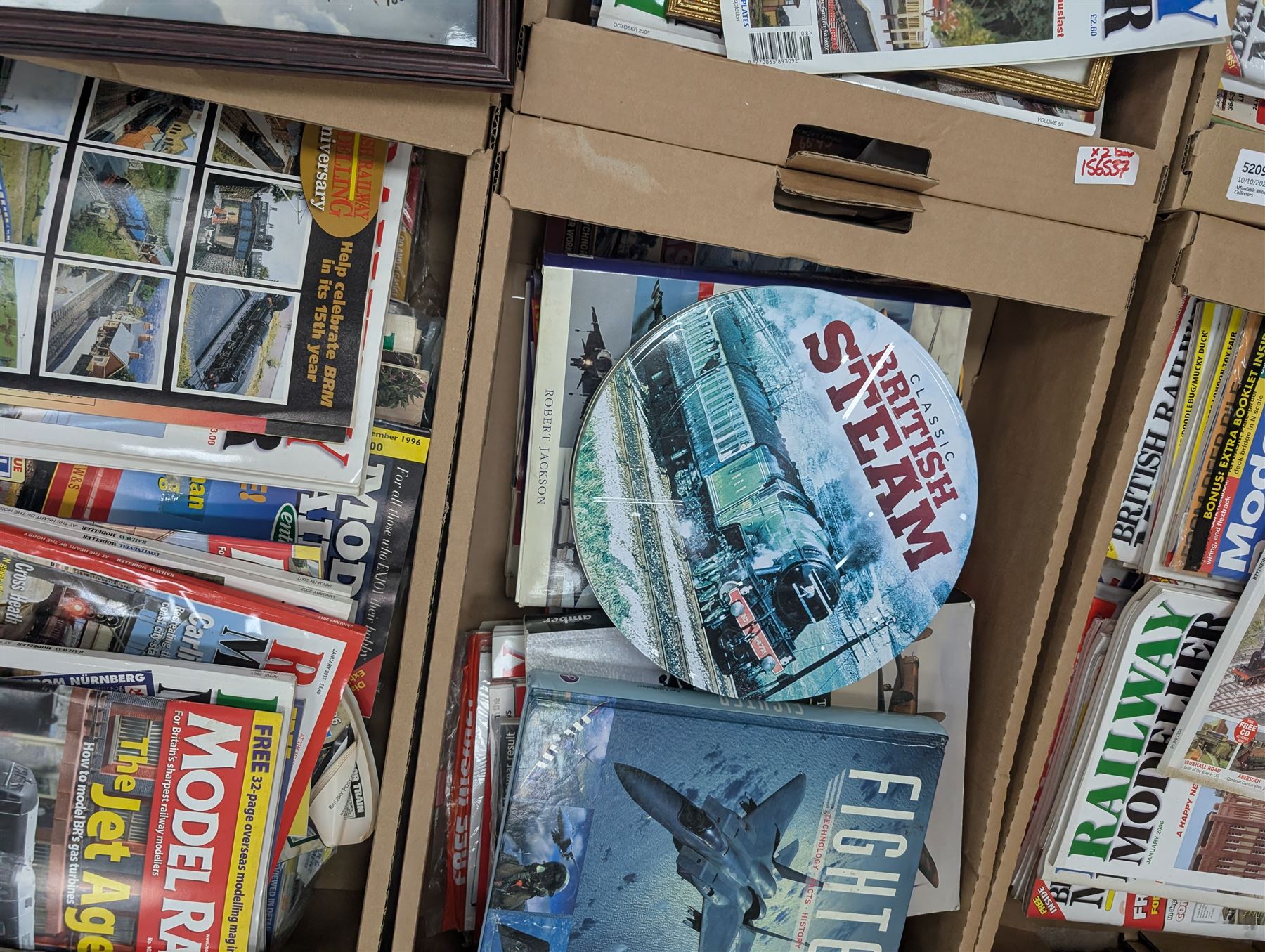 Large collection of model railway magazines, including Railyway Modeller, British Railway Modelling and Model Rail, together with railway and similar reference books, childrens books and VHS tapes in eleven boxes