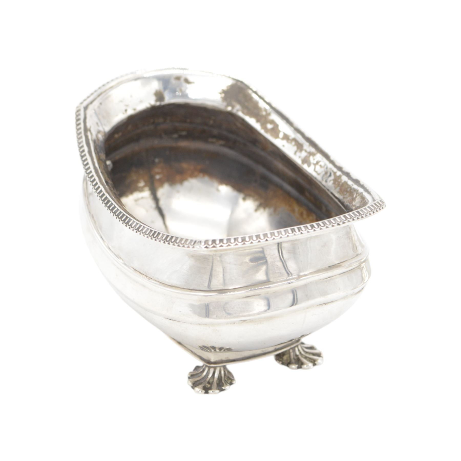 1920s silver sucrier and cover, of oval form with oblique gadrooned rim, the cover with rectangular finial, upon four splayed feet, H10.5cm