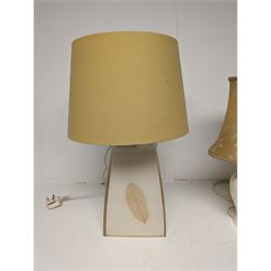 Two table lamps, to include pierced ceramic example, with gold floral shade, together with a tapering resin example, set with a leaf to each side, with fabric shade, tallest H