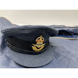 RAF Flight Lieutenant's uniform with peaked cap and WW2 ribbon bar; WW2 gas mask in blue canvas bag dated 1942; flying helmet date 1984; and British Army Major's uniform with Staybrite buttons and peaked cap