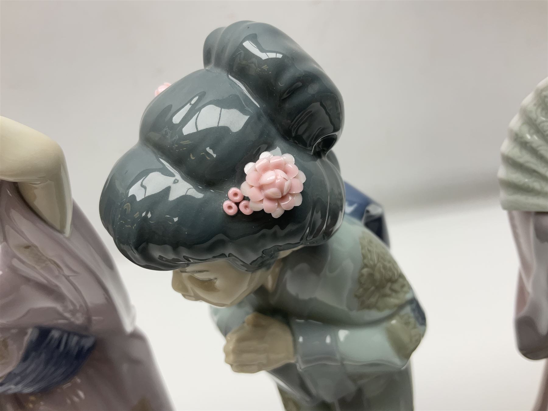 Three Lladro Japanese figures, comprising Sayonara no. 4989, Chrysanthemum no. 4990 and Madame Butterfly no. 4991, largest H30cm