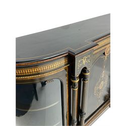 Victorian ebonised and inlaid credenza, break-front with curved ends, the front fitted with two curved glazed doors and central panelled door, inlaid with scrolling foliate and star motifs, quadruple turned and fluted pilasters to front, gilt egg and dart moulded edge on plinth base with figured walnut band, on turned feet