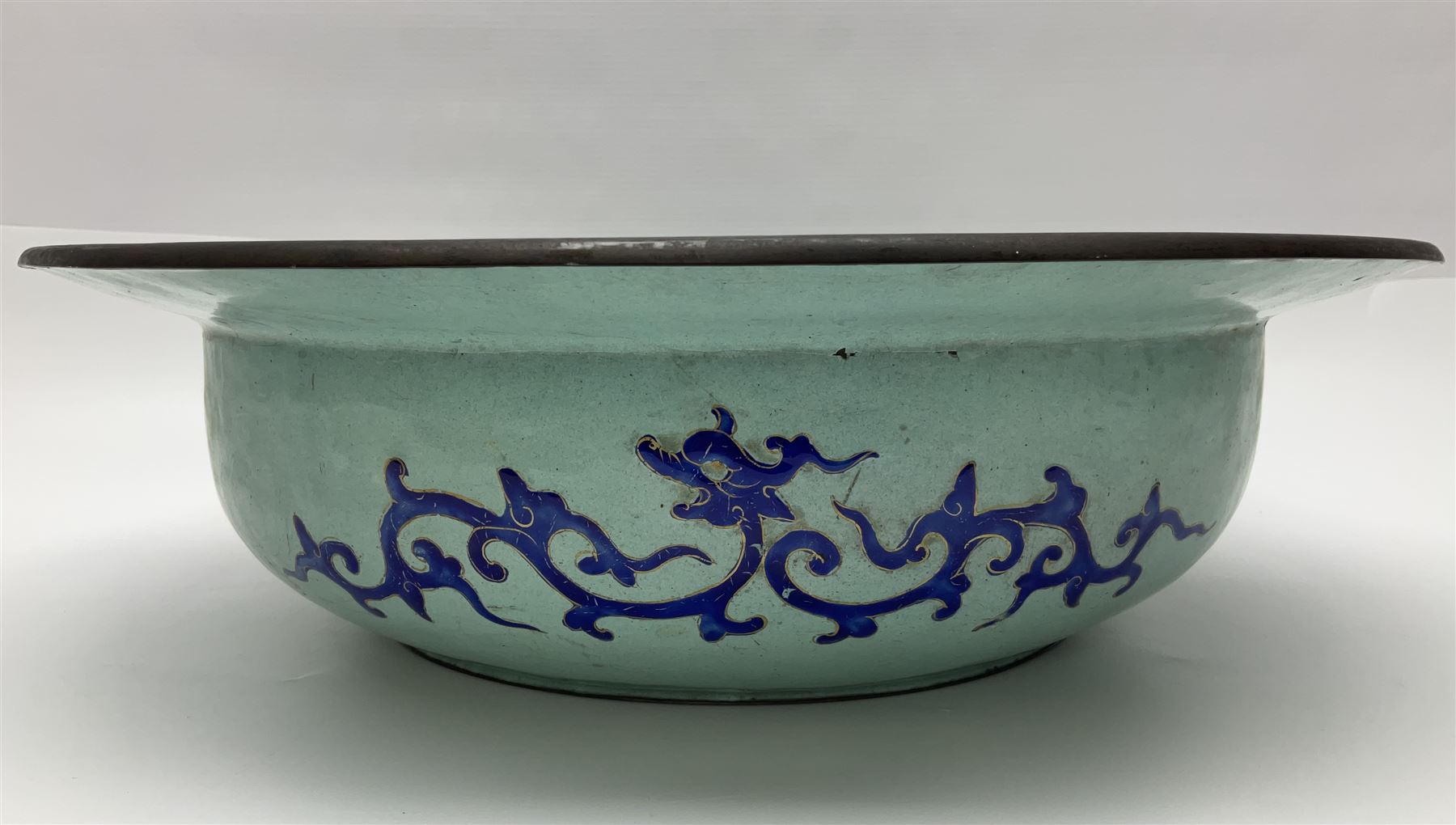 18th/19th century Chinese Canton enamel basin, the circular basin with flat everted rim, decorated with scrolling foliate and fruit decoration on a blue ground, D43cm