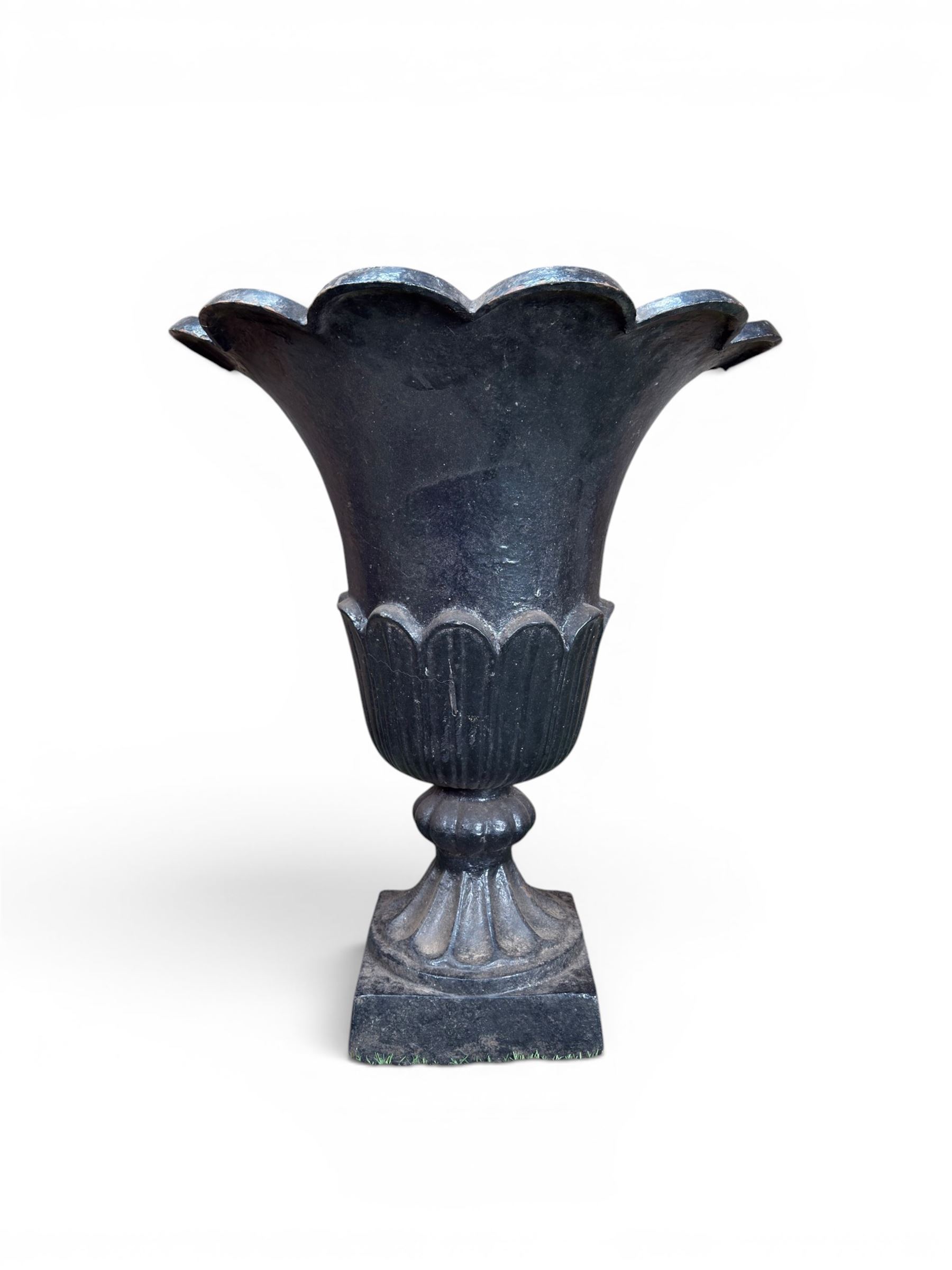 Pair of Victorian large scale cast iron garden urns, flared petal shaped rim with tapering waist, gadrooned base on square plinth, finished in black paint
