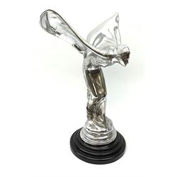 A cast Rolls Royce Spirit of Ecstasy style car mascot, raised upon a circular stepped wooden base, H36cm
