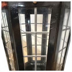 Georgian design black-painted metal octagonal hanging lantern, with brass ball finial above a hipped canopy, astragal glazed lattice panels and pendant ball terminal