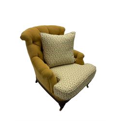 Victorian style armchair, upholstered in buttoned fabric with contrasting foliate pattern seat and scatter cushion, on turned front feet with castors