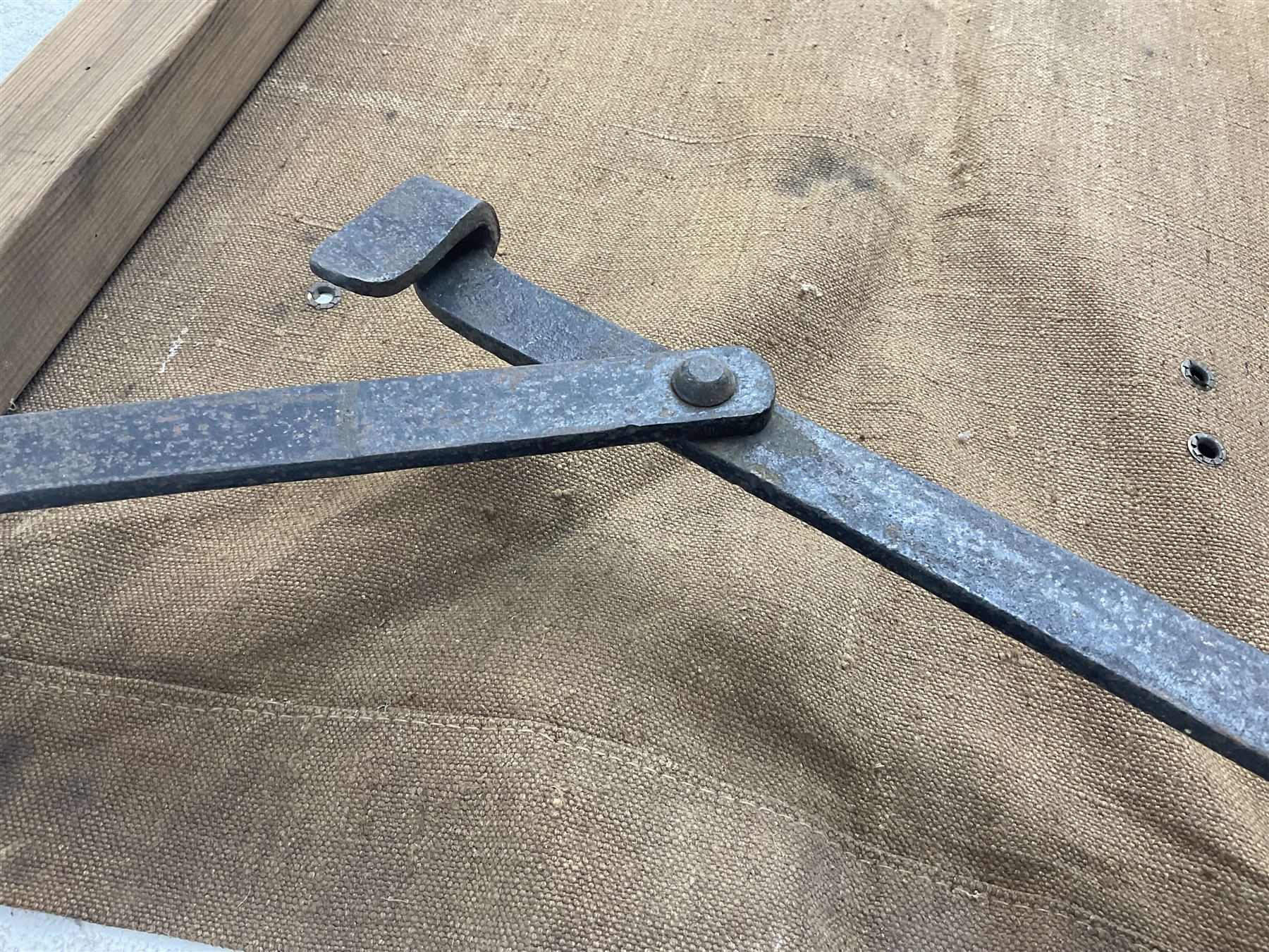 WW1 British casualty stretcher with iron mounted pitch pine sides and canvas base; stamped 'HL1917' and L7 with broad arrow in a triangle L236cm ( reputedly recovered from a barn at Bapaume on The Somme)