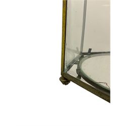 19th century brass and clear glass hexagonal hall lantern, with scrolling wire work open domed top over six arched panels, including a hinged door, the base enclosed with a circular glass panel on turned feet, H64cm