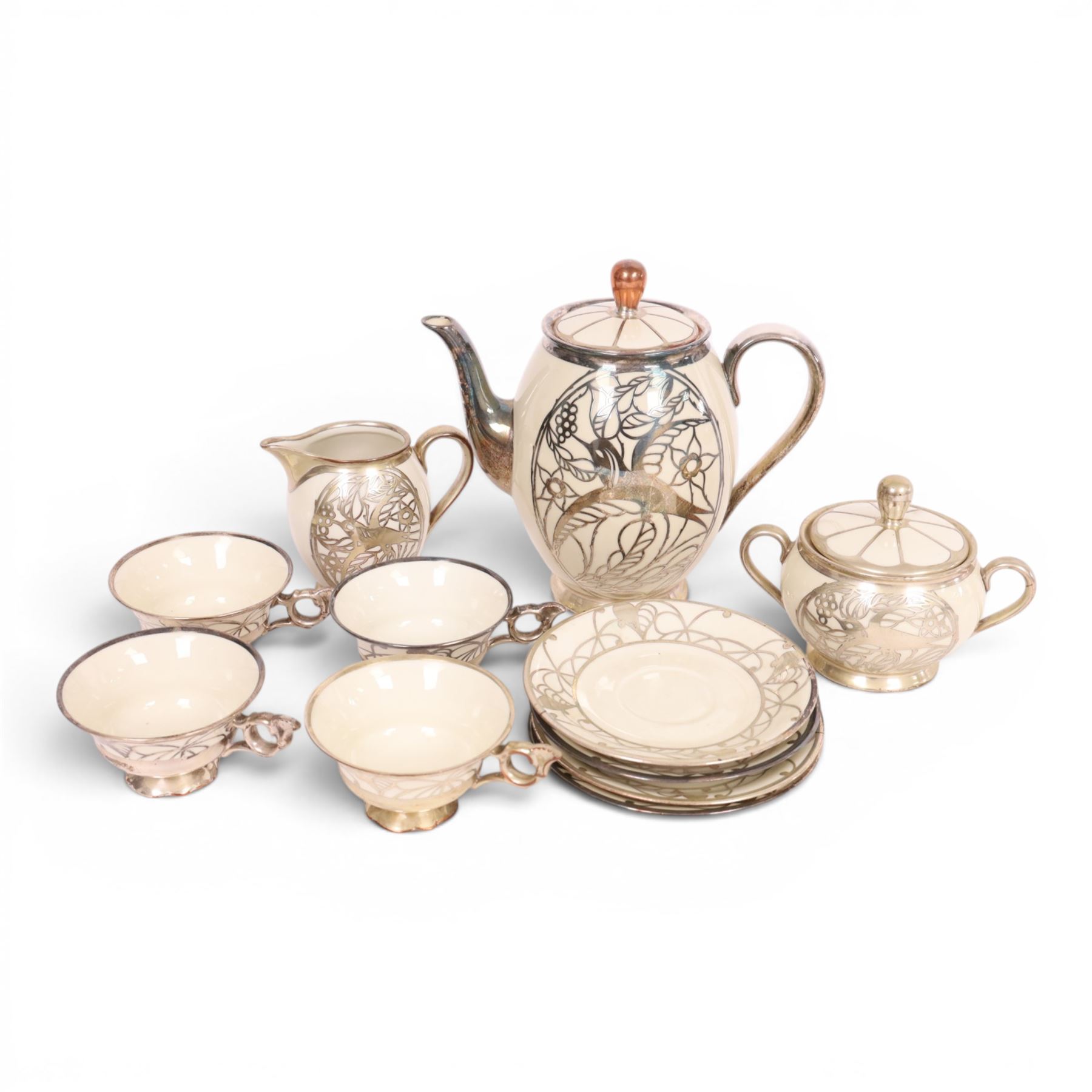 Jacob Hertel Bavarian tea service, decorated with silvered overlay of birds in foliage, comprising teapot, milk jug, covered sucrier three cups and saucers 