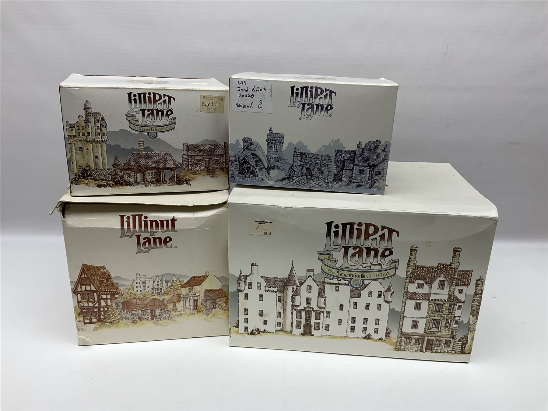 Four Lilliput Lane models from the Scottish Collection, to include Eilean Donan Castle, Claypotts Castle, John Knox House and Stockwell Tenement, all boxed 