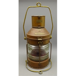  Meteorite copper and brass Not Under Command Ships lamp, No.P136227,cylindrical caged body, CGG clear glass lens with red filter, original burner with chimney, two swing handles, H52cm    