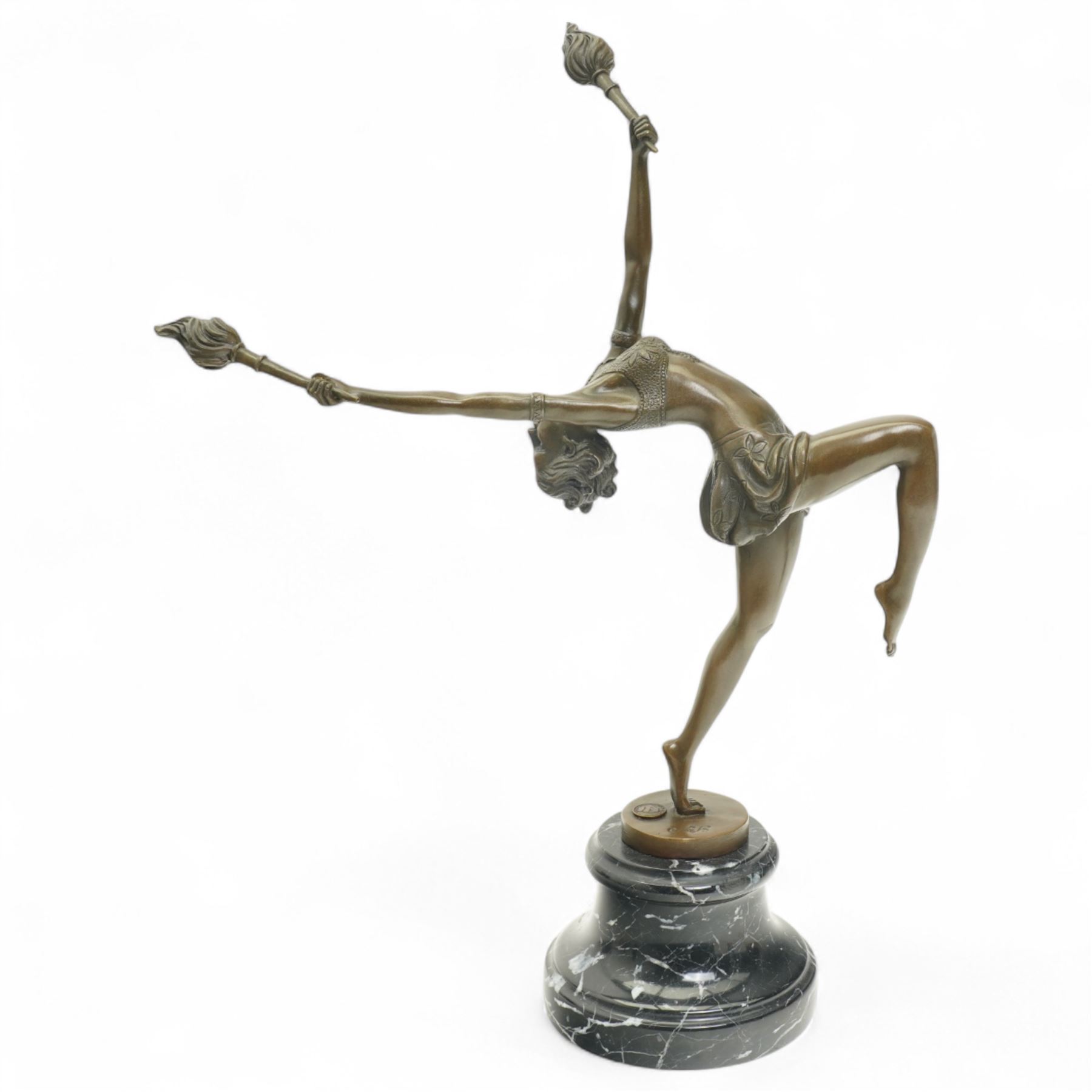 Art deco style bronze figure of a female dancing with flame torches, raised upon marble base, indistinctly signed, H43cm 