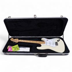 Fender Stratocaster electric guitar, serial no. P093223 made in Japan c.1993, with cream body, white scratch plate, maple neck, three pickups, three control dials and five way selector switch, in a black Fender USA hardcase, guitar L99cm