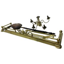 Brass fire fender with scrolled floral decoration (W140cm D43cm); brass fire tools, brass chandelier; and copper warming pan