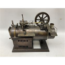 Stationary steam plant, probably early 20th century, the horizontal boiler with water gauge, whistle, safety valve, railed platforms and horizontal drive on top to 11cm flywheel; one cog marked Meccano; on oblong base L32cm
