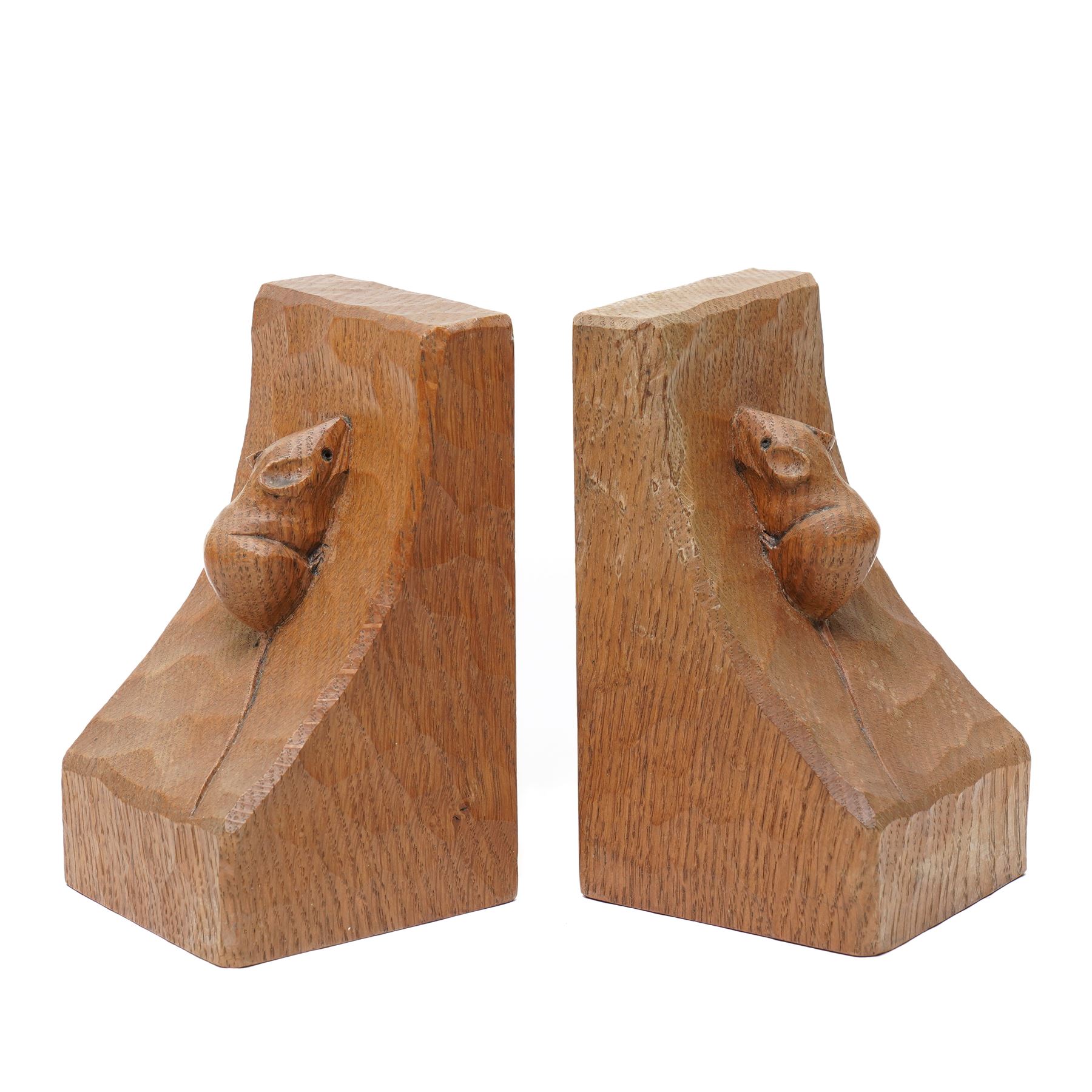Mouseman - pair of adzed oak bookends with carved mouse signature H15cm by the workshop of Robert Thompson, Kilburn